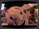 That quilted maple top has me all hot and bothered -- the Taylor T3/B sure is one fine looking guitar.Mike Ausman from Taylor gives us all the specs, which include the Taylor-made full humbuckers. Marc Seal, a man who certifiably loves Taylor, gives us a sampling of the T3/B's range.