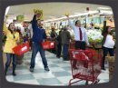For our latest mission, six undercover actors burst into song in a grocery store in Queens. Three minutes and lots of silly choreography later, they returned to their roles as shoppers and stock boys. The mission was filmed with hidden robotic, lipstick, and wearable cameras. The song was played over the store's PA system live.